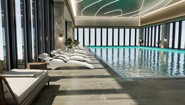 Modern indoor pool with lounge chairs and city view