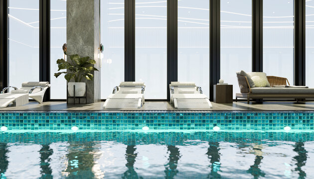 Modern indoor pool with lounge chairs in luxury spa