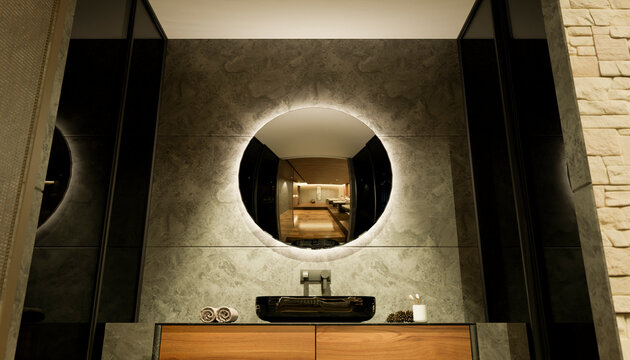Modern bathroom vanity with round backlit mirror and stone wall