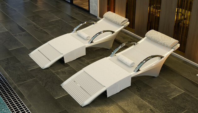 Modern spa lounge chairs by indoor pool in luxury resort