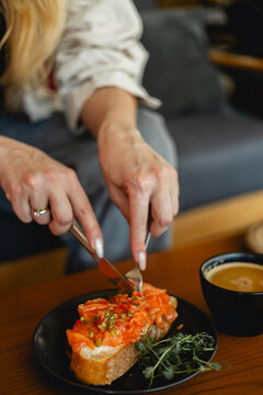Woman enjoys lunch in a cozy cafe setting