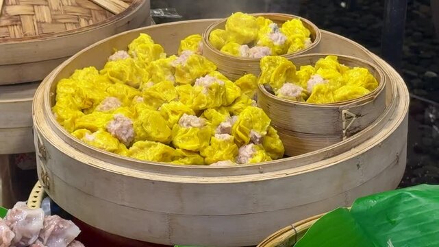 Delicious Thai Kanom Jeeb (Chinese Shumai) in a Steamer Basket