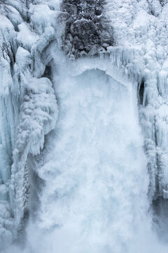Frozen waterfall and ice formations in Iceland winter