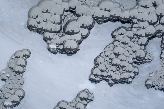 Winter snow and geothermal mud bubbles at Hverir, Iceland