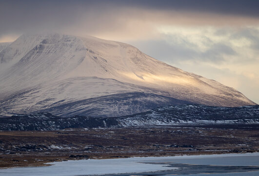 Snowy mountains near Hvitserkur, Iceland in winter light