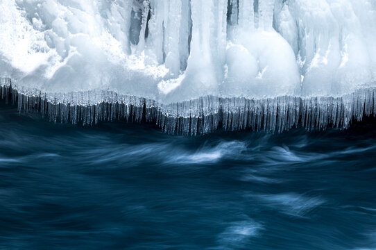 Winter ice formations and flowing water at Aldeyjarfoss