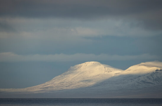 Winter mountains near Hvitserkur, Iceland under gray sky