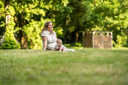Mother and baby girl enjoying happy summer family time