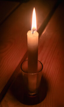 Candle light in a dark room symbolizing energy crisis