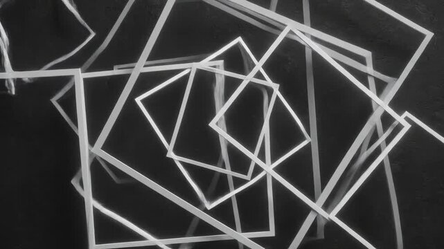 An intricate overlay of numerous geometric square frames rendered in a stark grayscale, creating a visually dynamic and abstract composition with a sense of depth and overlapping perspective