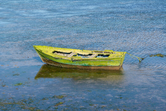 Old boat tethered in Combarro's coastal waters