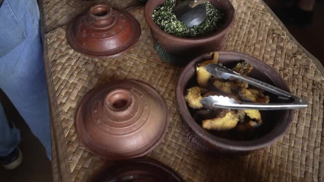 View of tourists demonstration of traditional curry and rice making in Hiriwadunna Village near Dambulla, Matale District, Sri Lanka, Asia
