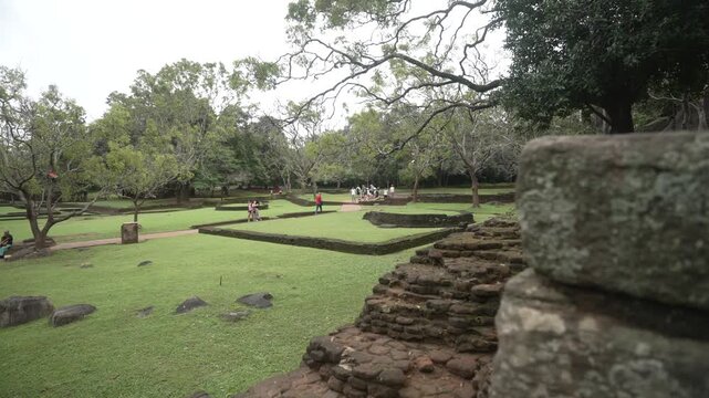 View of visitors in the ruins at the base of Lion Rock, Ancient Rock Fortress, Sigiriya, Sri Lanka, Asia