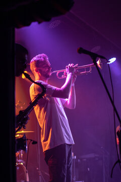 Trumpet player man performing live on stage in concert light