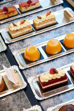 Assortment of gourmet mini desserts on silver trays