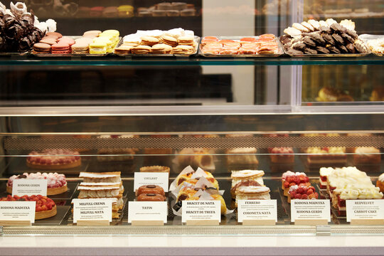 Pastry display case with assorted dessert in bakery