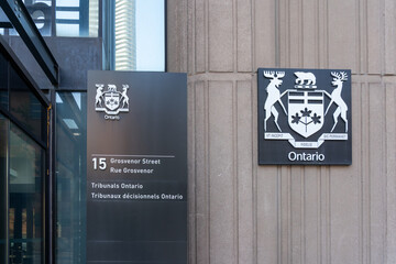 Fototapeta premium Toronto, Ontario, Canada - May 18, 2026: The entrance to the Landlord and Tenant Board ( LTB) on Grosvenor Street in Toronto, Canada. LTB is an independent, quasi judicial provincial tribunal that res