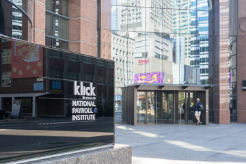 Fototapeta premium Toronto, Canada - May 18, 2026: The Klick Health ground sign sits outside their global headquarters on Bloor Street East in downtown Toronto, Canada. Klick Health, also known as Klick, is a Canadian 
