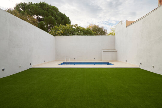 Modern courtyard with pool and minimal white walls