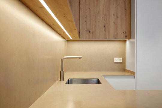 Modern minimalist kitchen with wood cabinet and sink