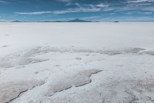 Uyuni Salt Flats' vast and cracked landscape in Bolivia