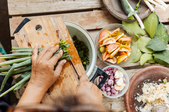 Preparing traditional Indonesian ingredients on rustic table