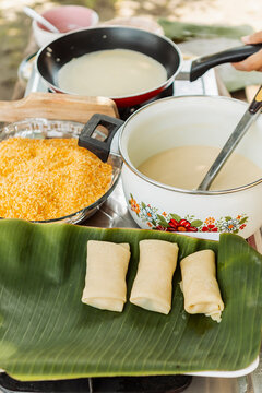 Traditional Indonesian snack preparation with banana leaf