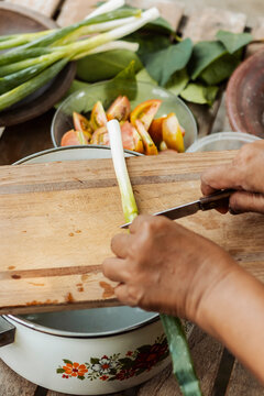 Preparing traditional Indonesian ingredients on wooden board