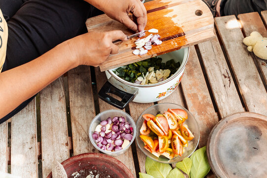 Preparing traditional Indonesian ingredients on rustic table