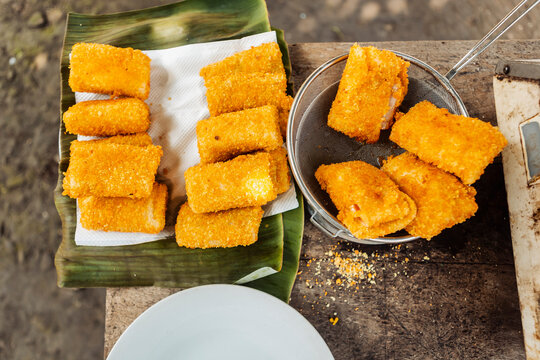 Golden fried Indonesian tofu snack on banana leaf