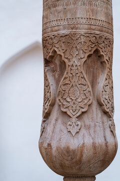 Ancient carved wooden column detail in Hiva, Uzbekistan