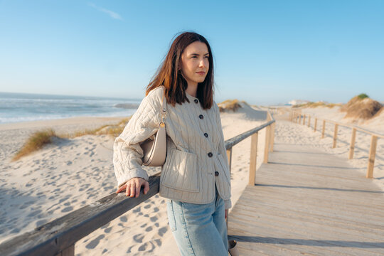 Woman enjoying the coastal view in Aveiro
