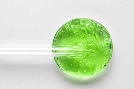 Green cosmetic gel with glass tube interaction