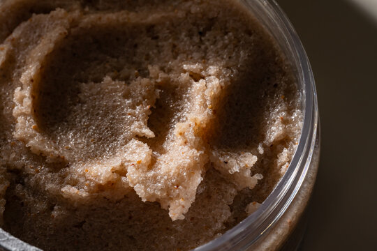 Close-up of body scrub texture smear in cosmetic jar