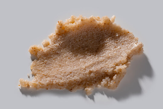 Body scrub smear texture on light background, macro closeup