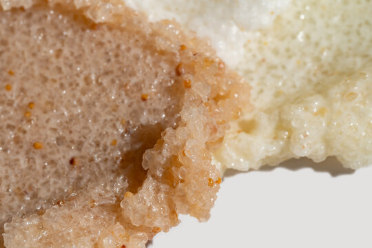 Body scrub texture smear with exfoliating grains closeup