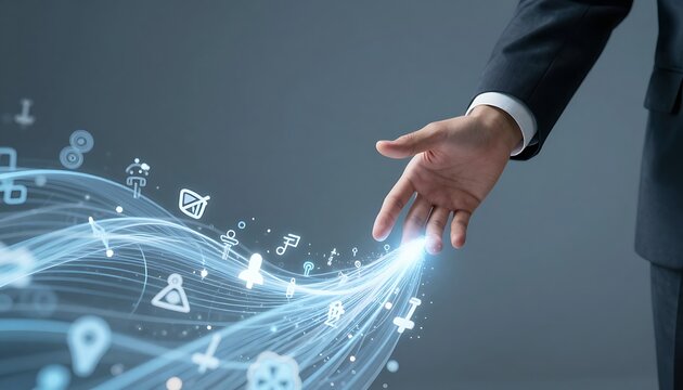Businessman&rsquo;s hand reaching toward a flowing wave of data with AI and technology symbols, highlighting data flow as key to business success.