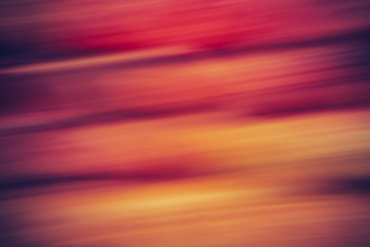 Abstract motion blur background with warm gradient streaks