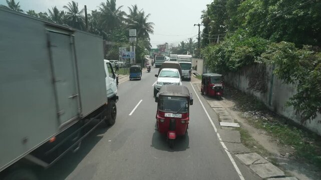 Elevated view tuk tuks and other traffic in road in Galle, Southern Province, Sri Lanka, Asia