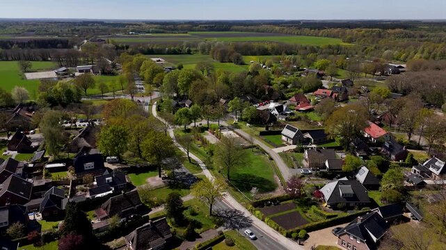 Aerial view of a dutch village surrounded by green countryside