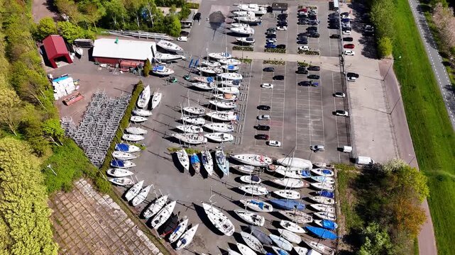 Aerial view of sailboats stored on land at a marina