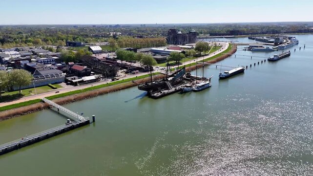 Aerial shot of barge sailing on oude maas river in netherlands