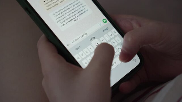 4K Close-Up of Woman Texting on Smartphone with Hands Holding Mobile Phone