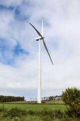 Fototapeta premium Wind turbine generating electricity using clean renewable energy