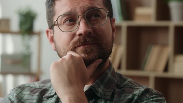 Portrait Caucasian man looking solution thinking in apartment at home dreaming adult middle-aged male thoughtful face indoors close up guy think business idea touch chin in living room hesitate decide