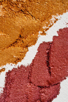 Metallic eyeshadow swatch texture in bronze and rose