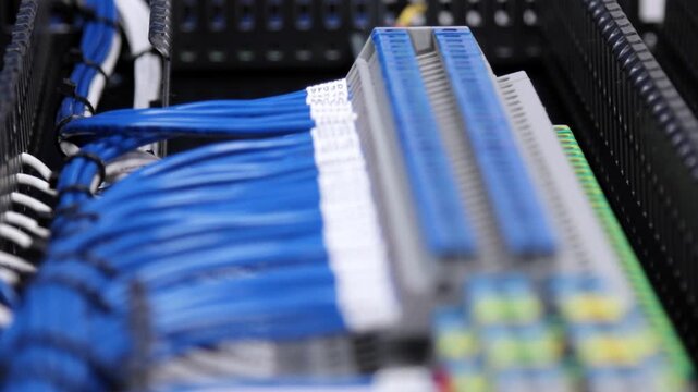 Connection of modules in an electrical switchboard using insulated copper wires tied with nylon ties. Soft focus. 