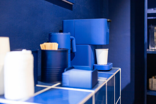 Blue interior of modern flower shop with accessories