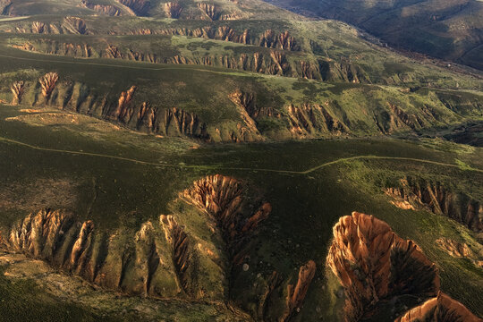 Spring badlands landscape with sand-colored ridges in Spain
