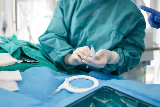 Hands of doctor preparing tracheotomy kit in ICU emergency care